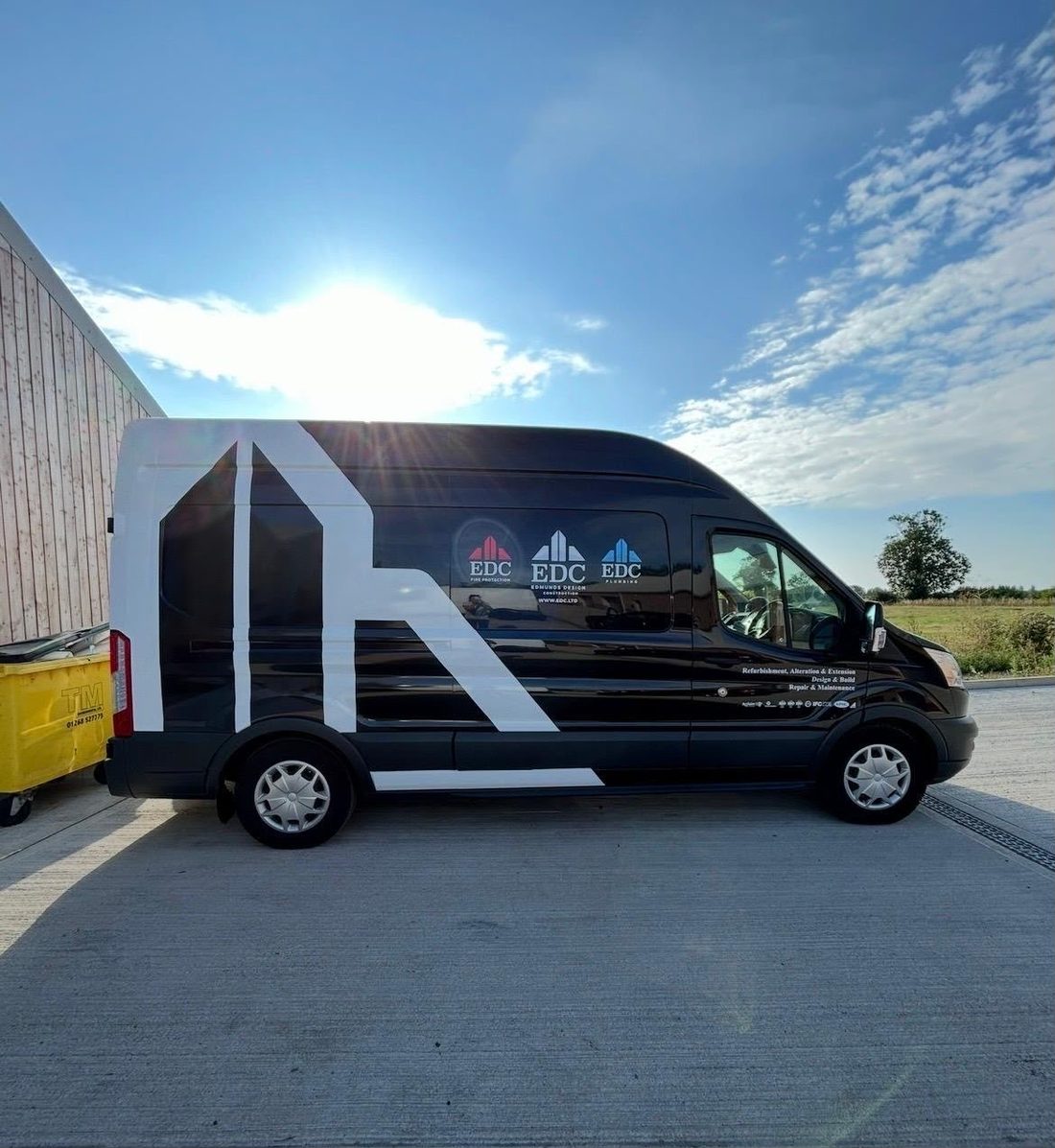 EDC Edmunds Design Construction van, black and white wrap by Lauryn Jaime Ltd