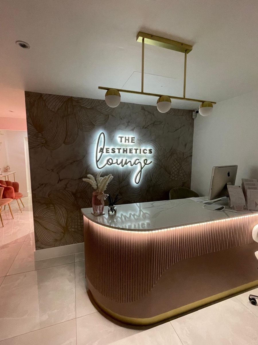 The Aesthetics Lounge reception desk and signage by Lauryn Jaime Ltd
