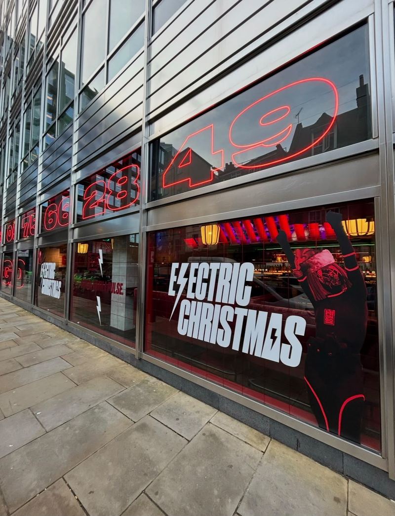 Electric Christmas illuminated window graphics by Lauryn Jaime Ltd
